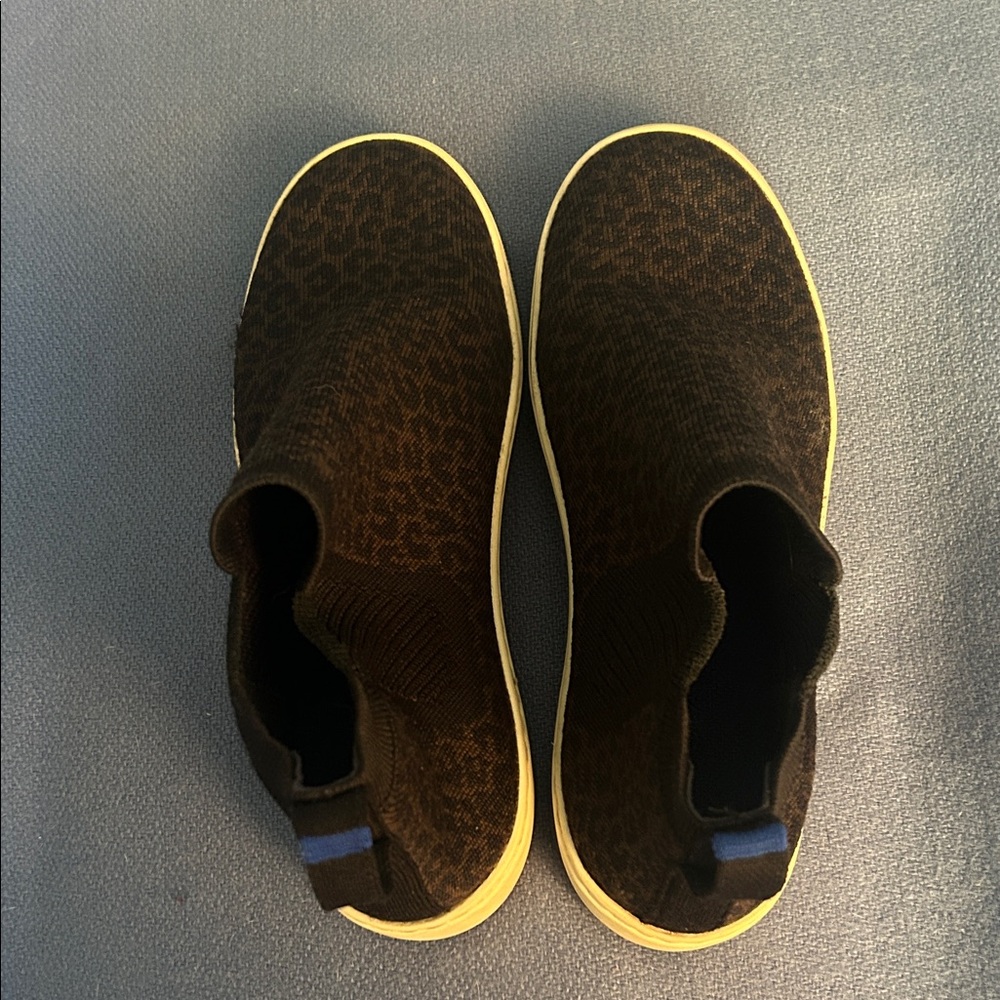 Rothy's Black Slip-On Sneakers with Blue Stripe